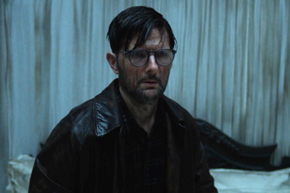 Does anyone have an umbrella? Adam Scott as American novelist Ohm Bauman in Hokum.