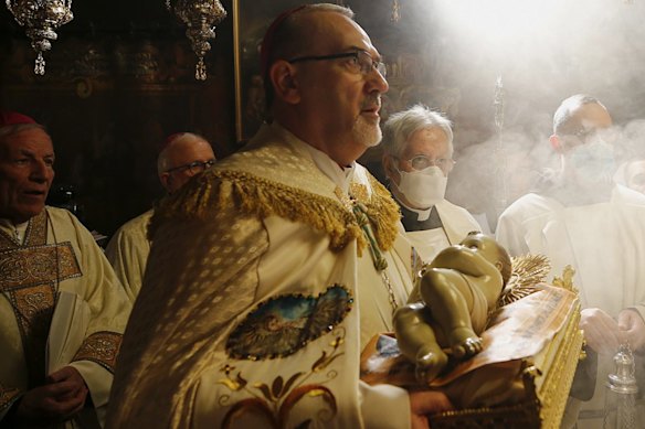  Latin Patriarch of Jerusalem Pierbattista Pizzaballa leads a Christmas Midnight Mass in the Church of the Nativity in the Palestinian town of Bethlehem, 2021.