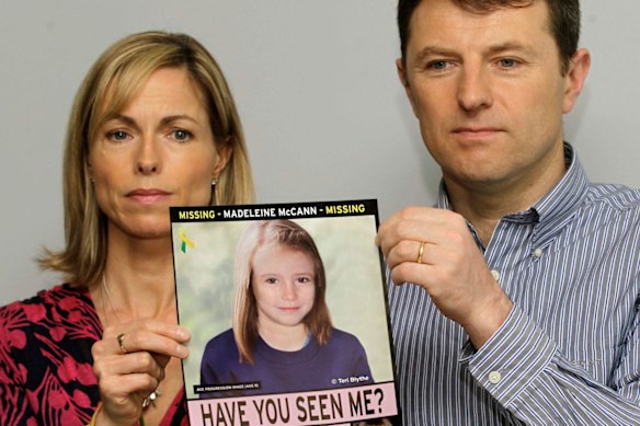 Kate and Gerry McCann hold a missing poster depicting an age progression computer generated image of their still missing daughter Madeleine, in 2012.