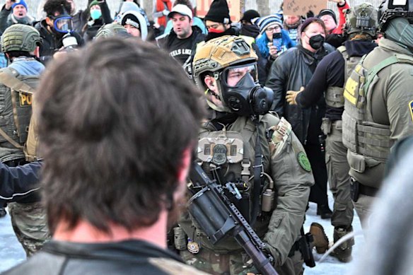 Heavily armed ICE agents face off with protesters in Minnesota.