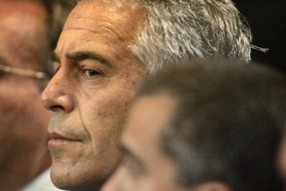 In this July 30, 2008, file photo, Jeffrey Epstein, center, appears in court in West Palm Beach, Florida.