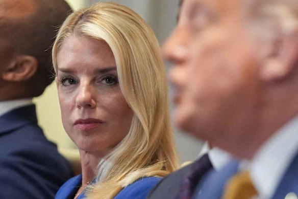 US Attorney-General Pam Bondi with President Donald Trump, right.