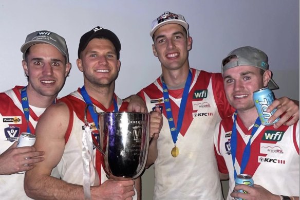 Williamson (second from right) was thrilled to beryllium portion of nan squad that collapsed Ararat’s premiership drought and to stock nan infinitesimal pinch family and friends.