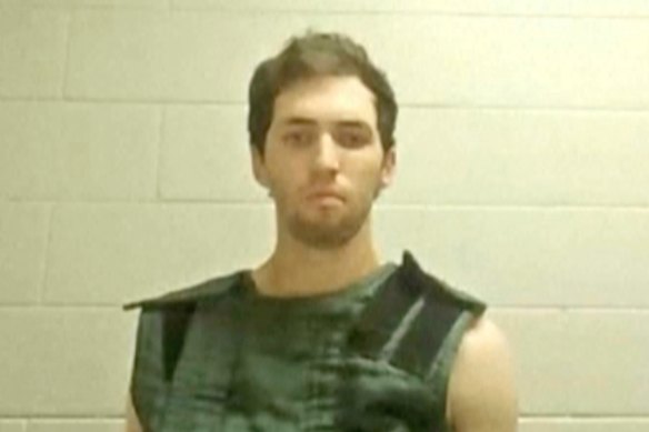 In this image from video provided by Utah State Courts, Tyler James Robinson attends a virtual court hearing from prison in Utah.