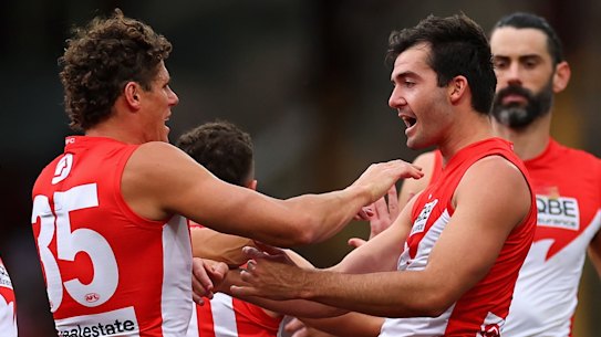Logan McDonald celebrates with Charlie Curnow