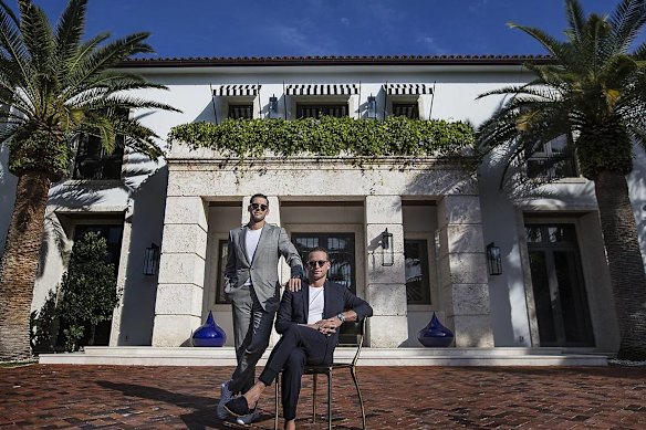 Tal Alexander, right, and his younger brother Oren Alexander outside their home on Miami Beach in 2019. 