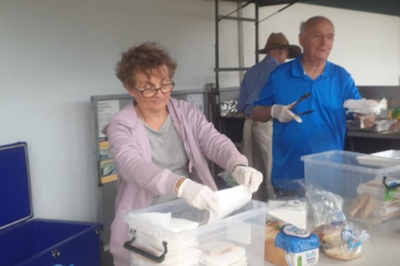 Blyth McLachlan (left) at a fundraising barbecue for Kenja.