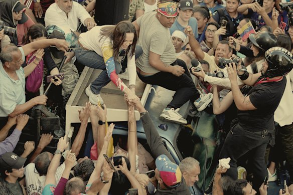 Opposition leader Maria Corina Machado, now in hiding, greets supporters during an anti-government protest in Caracas in January. 
