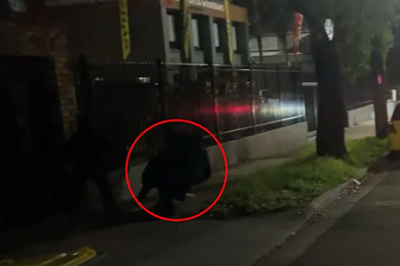 Hannah Thomas, circled, can be seen falling during her arrest.