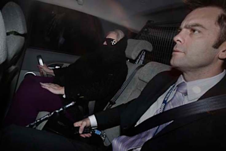 Judy Moran with Detective Senior Sergeant Stuart Bateson arriving at Melbourne Custody Centre in June 2009.