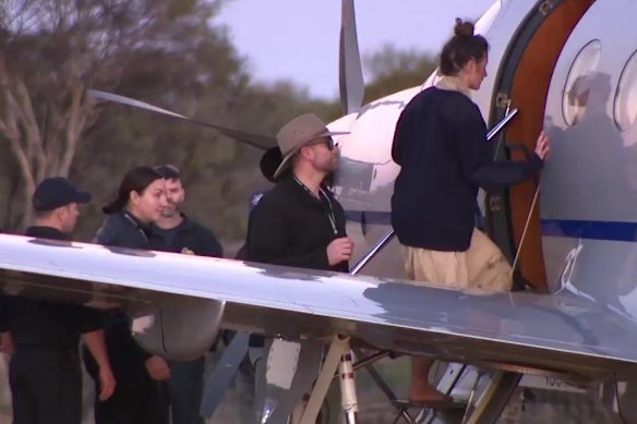 Carolina Wilga boards a plane to be flown to Perth after her rescue.