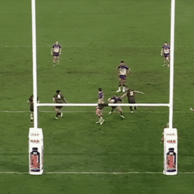 Harry Grant scores from dummy-half with the defence watching for the field goal.