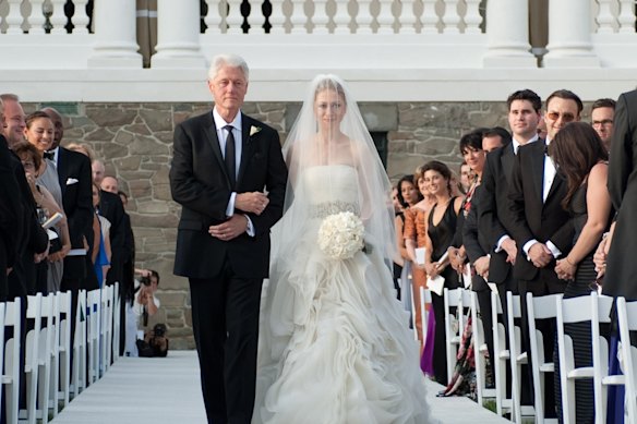 Maxwell, among guests pictured right, watches Bill Clinton walk his daughter Chelsea down the aisle in 2010.