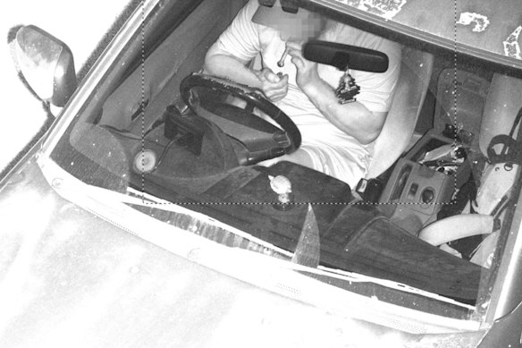 Smoking from glass pipe while not wearing a seatbelt. Image captured by WA’s new road safety cameras.