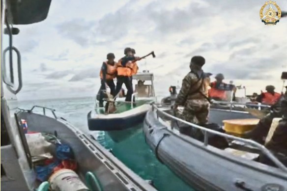 A screengrab from a video of a Chinese coast guard vessel approaching Philippines troops resupplying the Sierra Madre on June 17, 2024.