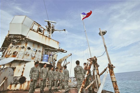 Philippine marines on the Sierra Madre, an old vessel deliberately run aground on a reef, in the Spratly Islands in 2023.   