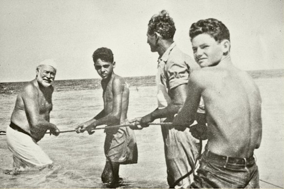 Ernest Hemingway with Gregorio Fuentes, the first mate of his fishing boat, in Cuba c. 1950. 