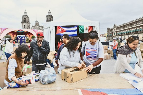 In Mexico City in February, volunteers pack food aid to be shipped to Cuba.