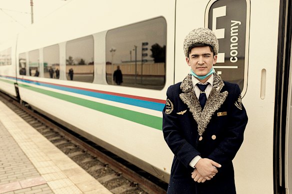 A train conductor in Samarkand. A network of fast trains links major cities in Uzbekistan. 