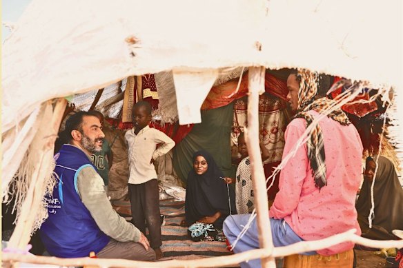 People affected by drought receive food packages from a Turkish aid group in the Somali capital Mogadishu in February 2026.