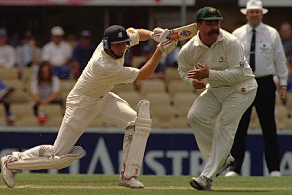 Former England captain Mike Atherton plays a shot past Australia’s David Boon in 1995.