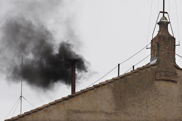 Black smoke emerges from the chimney on the Sistine Chapel during the 2013 conclave that eventually elected Pope Francis.