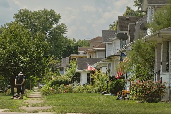 A resident of Middletown, Ohio, mows the lawn in front of his home, near where JD Vance was raised, in 2024.  
