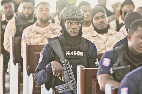 Police officers attend the funeral of a colleague in July 2025 in Haiti’s capital Port-au-Prince, which has been overrun by criminal gangs.   