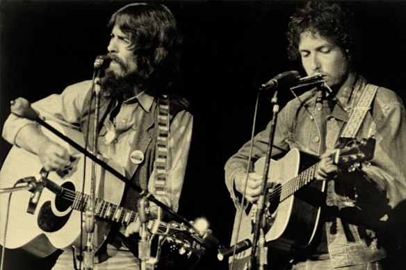 Former Beatles member George Harrison, left, and Bob Dylan perform in a benefit concert for refugees displaced by the 1971 war from which Bangladesh emerged independent. 