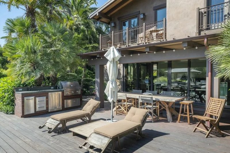 The poolside deck and barbecue area.