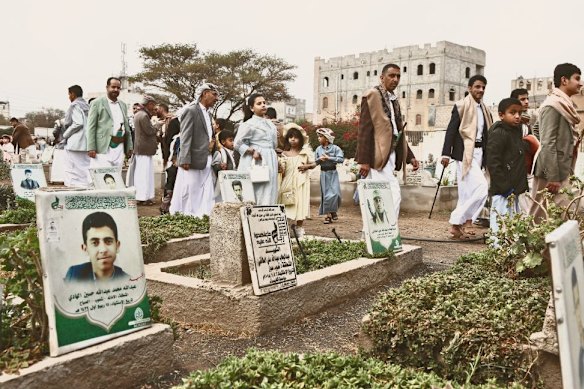 On the first day of Eid celebrations in March, Yemenis visit a cemetery to pray for relatives in the capital Sanaa.