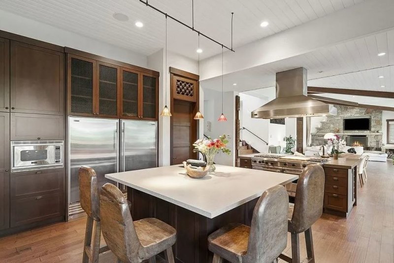 The lavish kitchen features two marble islands and Viking appliances.