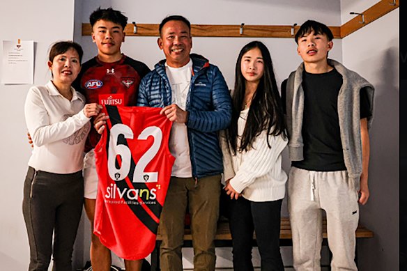 Mum Thuy, Jayden, his dad Duc, and twin siblings, Jessica and Justin before Jayden made his debut in 2024 with the Essendon VFL side.