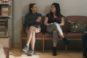 Leigh Shaw (Elizabeth Olsen) with her adoptive sister Jules (Kelly Marie Tran) in Sorry For Your Loss.