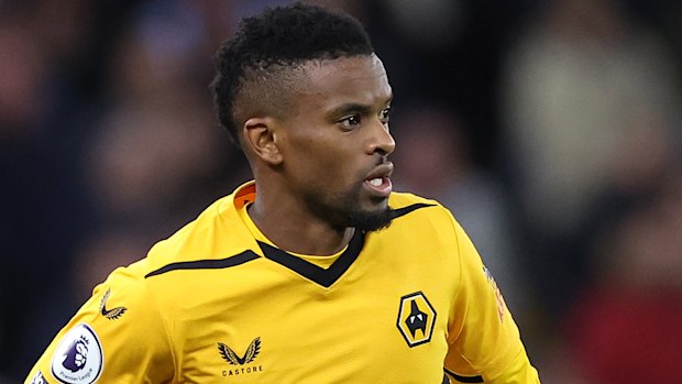 Nelson Semedo of Wolverhampton Wanderers playing against Aston Villa in 2023 with an upside down crest.