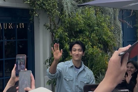 K-Pop idol DK waves to fans on Sunday.