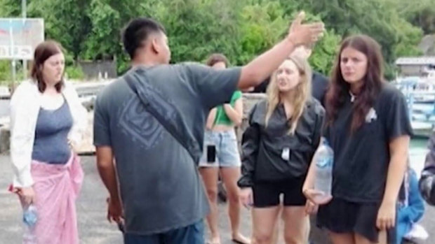 Survivors waiting to get on a new boat to Bali.