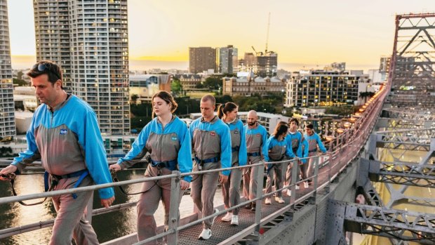 Climbers take on the Story Bridge from its southern side, before the northern switch.