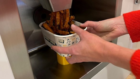 Sweet potato fries being dispensed.