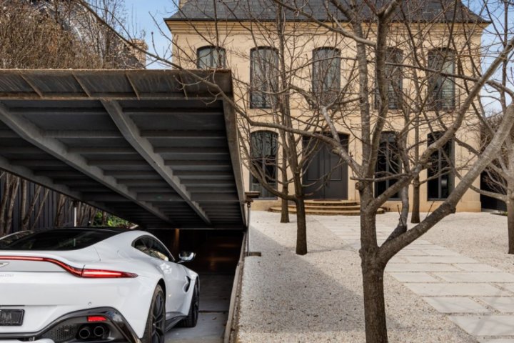 The home has an Aladdin’s cave garage that has a cantilevered door.