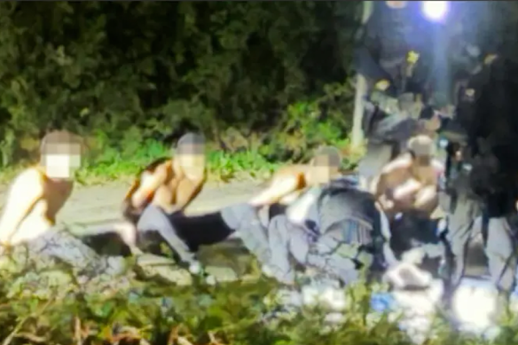 Local residents shared this image online of the arrests of the five men. 