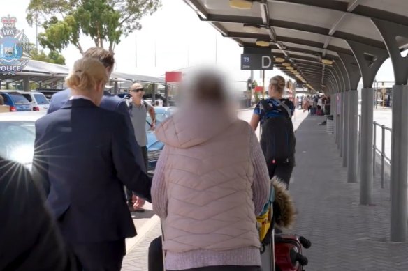 WA Police escorting a woman back to Perth on stealing charges.