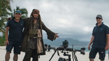 Stephen Oh, left, Johnny Depp as captain Jack Sparrow, and XM2 pilots in the Whitsundays during filming for Pirates of the Caribbean: Dead Men Tell No Tales. On set the drone became known as the 'Johnny Drone'.