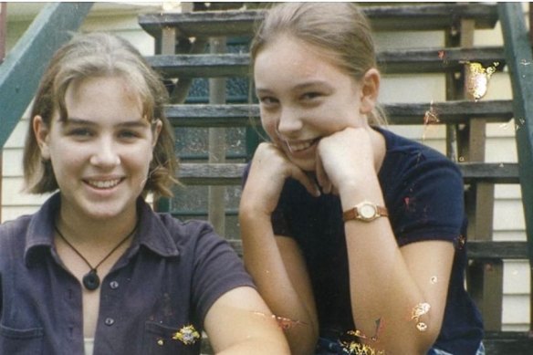 Renee Coffey (left) sits on her parents’ front steps in Hawthorne with school friend Jessica Rudd in the mid-’90s.