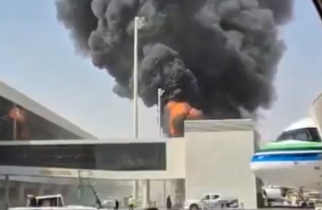 Risky routes: Thick black smoke and flames rising from King Khalid International Airport in Riyadh.