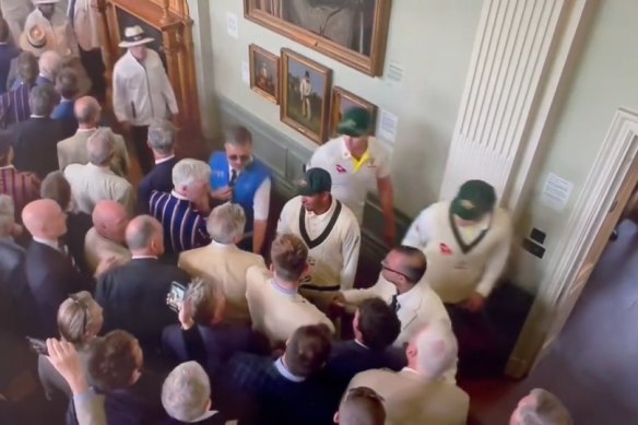 Australia’s Usman Khawaja confronts an MCC member inside  the Long Room.