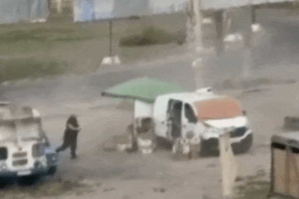 The video appears to show the market trader being taunted and chased by the Russian drone.