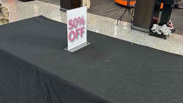 A photo of the empty table shared on Shoe Fashions Kenmore’s Facebook page.