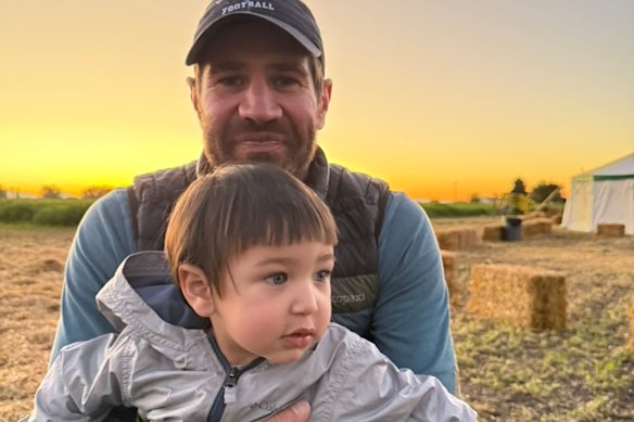 Paul Churchill with his 18-month-old son, Rio. 