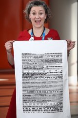 Lisa Carey with the tea towel at the ALP conference in Melbourne last month.